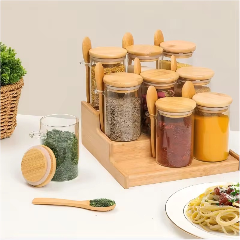 Glass spice jars with bamboo lids on rack